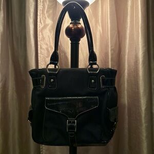 Chic Black Shoulder Bag with Front and Side Pockets